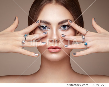Fashion portrait of young beautiful woman with jewelry 90791270