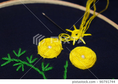 woolen handicraft work with circle frame on cloth woolen handicraft work with circle frame on cloth 90791744