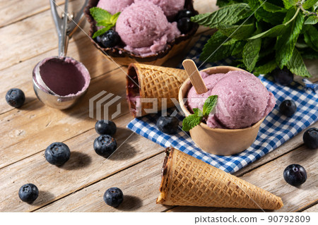 Blueberry ice cream scoops with waffle 90792809