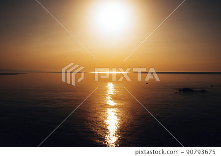 sunset at sea. variety of colors and hues of the rising sun. . High quality photo 90793675