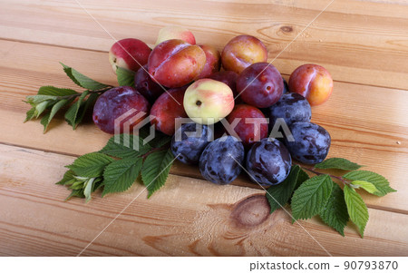 Plums on table 90793870