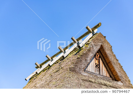 Blue sky and thatched roof Blue sky and thatched roof 90794467
