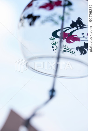 Glass wind chime swaying in the wind h 90796282