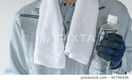 Men in work clothes with PET bottles | Image of measures against heat stroke in the construction industry 90796696
