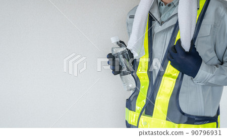 Men in work clothes with PET bottles | Image of measures against heat stroke in the construction industry 90796931
