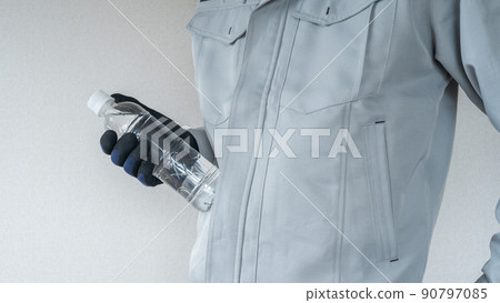 Men in work clothes with PET bottles | Image of measures against heat stroke in the construction industry 90797085