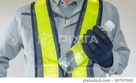Men in work clothes with PET bottles | Image of measures against heat stroke in the construction industry 90797088