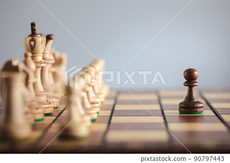 chess piece facing with another team on chess board 90797443