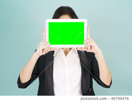 Young women in suit holding her digital tablet mock up 90798476
