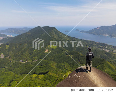 Aerial photograph of a person standing on the rock behind the elephant in Mie Binshiyama taken from a drone 90798496