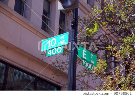 Green 10 Street North West historic sign in downtown Washington D.C. at the intersection with E North West Street Green 10 Street North West historic sign in downtown Washington D.C. at the intersection with E North West Street 90798861