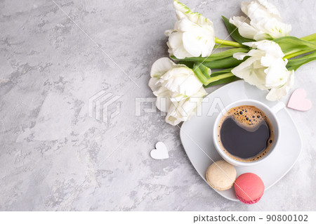 Colorful french macarons and cup of coffee  90800102