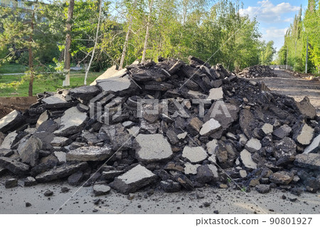 Mountain of removed asphalt pavement. Road repair concept 90801927