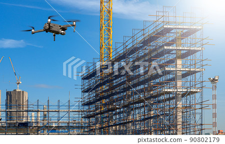 ..Drone over construction site. video surveillance or industrial inspection.. ..Drone over construction site. video surveillance or industrial inspection.. 90802179