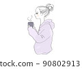 Side profile girl in a hoodie drinking a hot drink 90802913