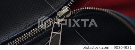 Closeup of zipper on blue leather jacket 90804921
