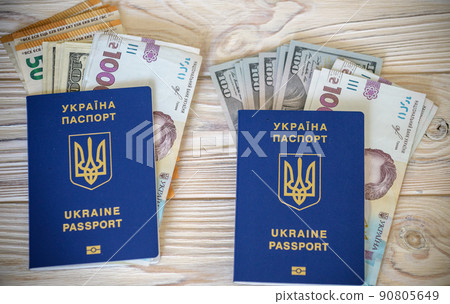 New banknotes in denominations of 1000 hryvnia with a Ukrainian passport. Ukrainian money. Business concept. Background with hryvnia New banknotes in denominations of 1000 hryvnia with a Ukrainian passport. Ukrainian money. Business concept. Background with hryvnia 90805649
