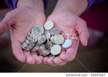 Many Ukrainian kopecks in hand. UAH. Currency of Ukraine. Keep the money Many Ukrainian kopecks in hand. UAH. Currency of Ukraine. Keep the money 90805667