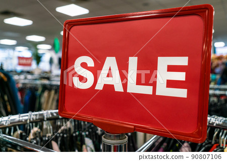Sale Sign On Rail in Clothes Shop 90807106
