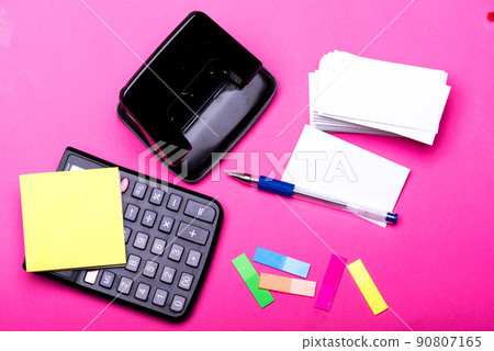 Business and work concept. Hole punch, pen, notes and calculator Business and work concept. Hole punch, pen, notes and calculator 90807165