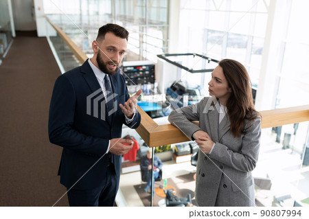 car dealership employees discuss business development strategy 90807994
