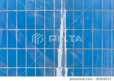 Blue ceramic tile wall with paint splash Blue ceramic tile wall with paint splash 90808031