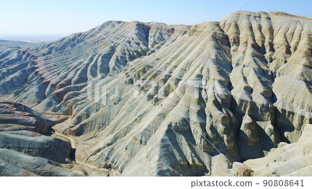 Colored mountains of Aktau in the steppe. Colored mountains of Aktau in the steppe. 90808641