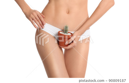 Woman with flower showing smooth skin after bikini epilation on beige background, closeup Woman with flower showing smooth skin after bikini epilation on beige background, closeup 90809187