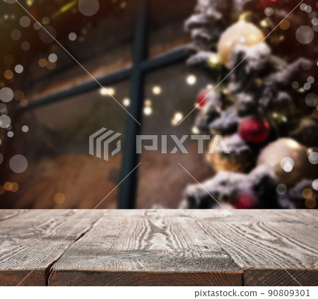 Empty wooden surface and blurred view of Christmas tree 90809301