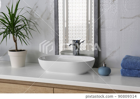 Modern mirror and vessel sink in stylish bathroom 90809314