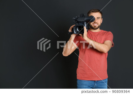 Operator with professional video camera on black background, space for text Operator with professional video camera on black background, space for text 90809364