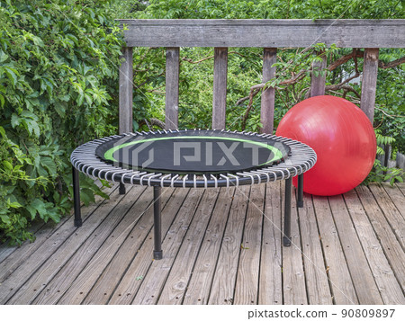 mini fitness trampoline and exercise ball in backyard patio mini fitness trampoline and exercise ball in backyard patio 90809897