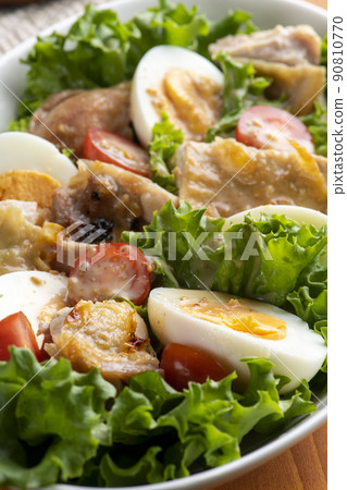Grilled chicken thigh chicken salad on the table Grilled chicken thigh chicken salad on the table 90810770
