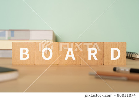 A desk with a block labeled "BOARD" 90811874
