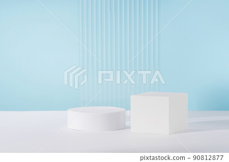 Acrylic ribbed plate, podium, background for cosmetic product packaging on blue backdrop. Showcase for jewellery presentation, display for perfume advertising, cosmetics branding scene 90812877