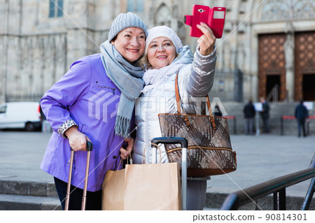 Senior ladies making selfie outdoors Senior ladies making selfie outdoors 90814301
