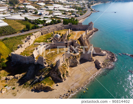Aerial view of Mamure Castle on Mediterranean coast against backdrop of Bozdogan village Aerial view of Mamure Castle on Mediterranean coast against backdrop of Bozdogan village 90814402