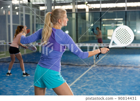 European woman playing padel European woman playing padel 90814431