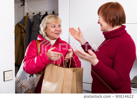 smiling mature female taking friend woman 90814622