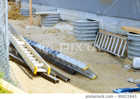 Building unfinished construction window well for basement 90815843