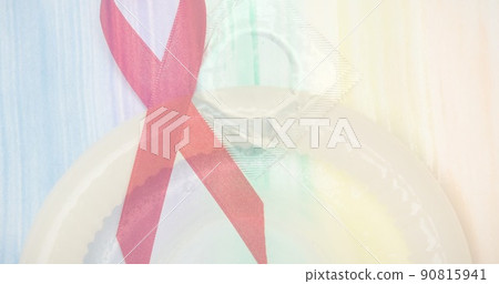 Double exposure of red ribbon and condom, copy space Double exposure of red ribbon and condom, copy space 90815941