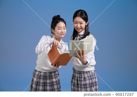 mz generation, asian girl students who are looking together together 90817287
