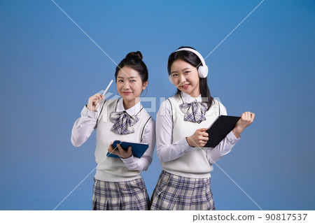 mz generation, asian girl students holding tablet pc photos image 90817537