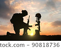 3D illustration of a military man kneeling in front of Fallen Soldier grave during sunset 90818736