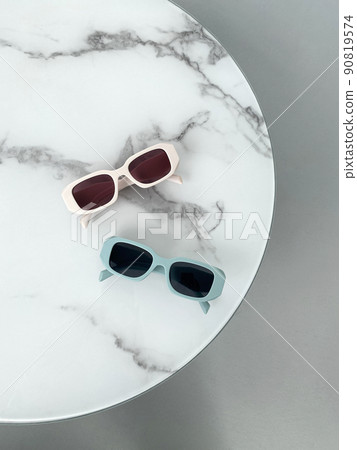fashion still life. female sunglasses on the table fashion still life. female sunglasses on the table 90819574
