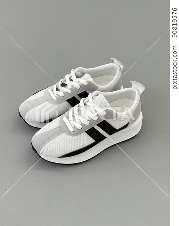 cool white sneakers. sport shoes still life cool white sneakers. sport shoes still life 90819576