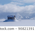 A work hut standing on a snowy hill in the mountains during the cold season 90821391