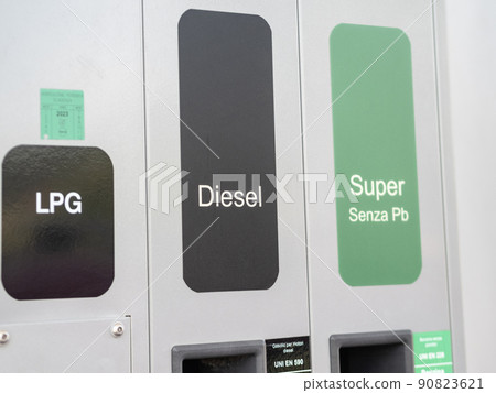 Rome, Italy - May 31, 2022: Fuel pump nozzles for LPG, Diesel B7 and Super E5 in a filling station 90823621