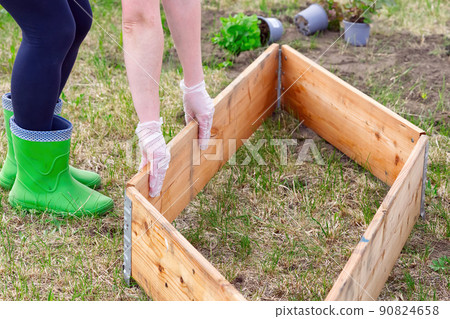 empty beds of wood ready for planting berries. 90824658