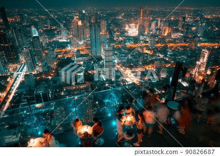 Night modern business Bangkok city aerial view on cyber punk theme color Night modern business Bangkok city aerial view on cyber punk theme color 90826687